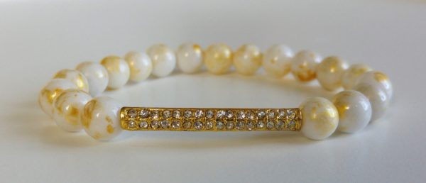 Candy jade med guldfärgad strassbåge